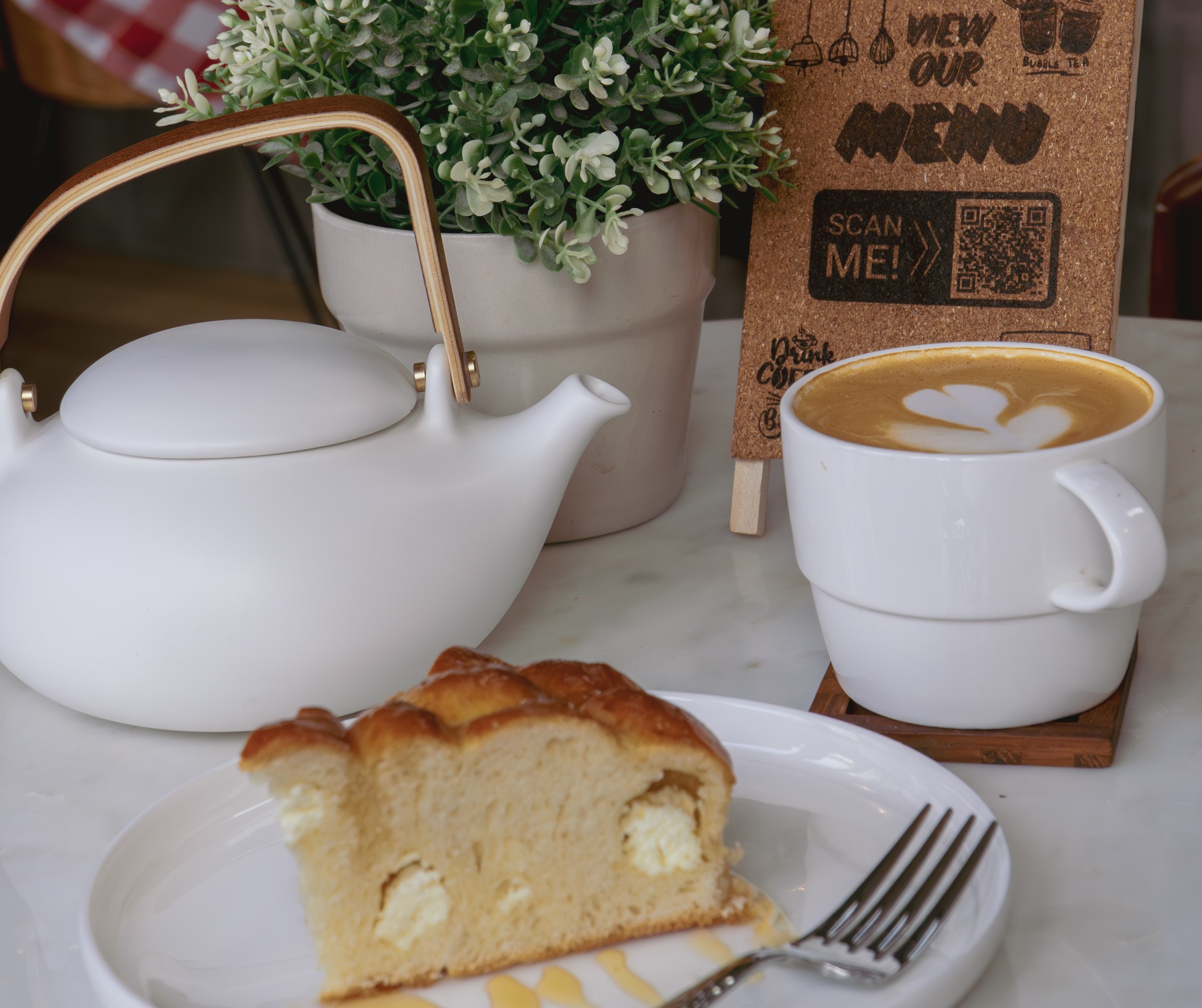 Teapot, coffee, and pastry